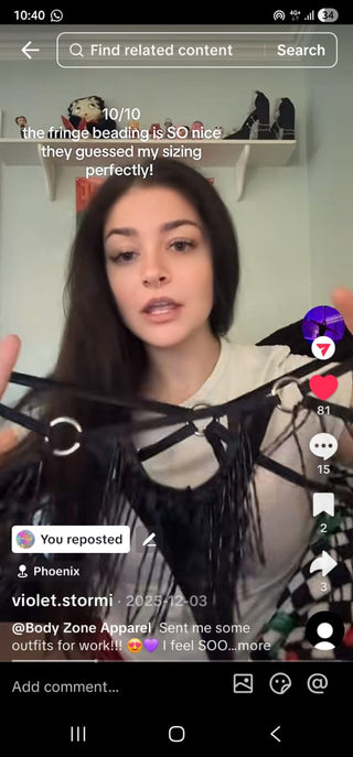 Person holding a black fringe beaded top with text overlay on a smartphone screen